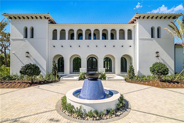 50 Mahogany Dr, Naples, FL 34108 - rear view of house featuring stucco siding