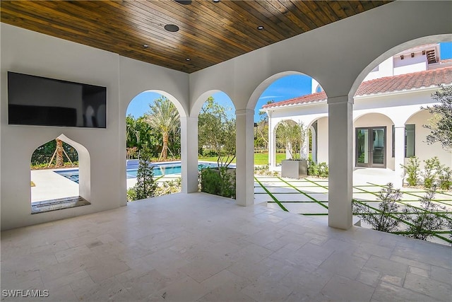 50 Mahogany Dr, Naples, FL 34108 - view of patio / terrace with an outdoor pool and french doors