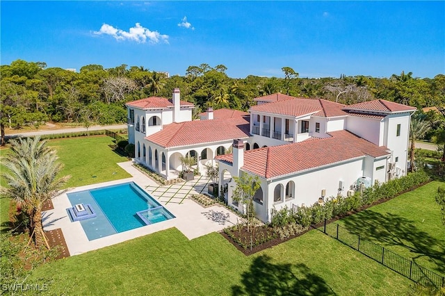 50 Mahogany Dr, Naples, FL 34108 - back of house with a patio, a tile roof, stucco siding, a yard, and a fenced backyard
