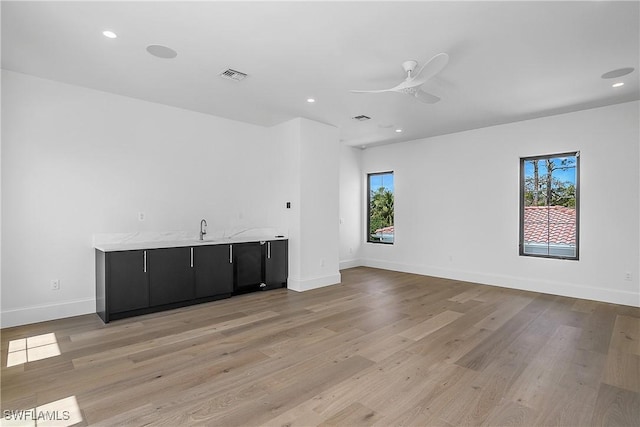50 Mahogany Dr, Naples, FL 34108 - spare room with visible vents, a healthy amount of sunlight, and light wood-style floors