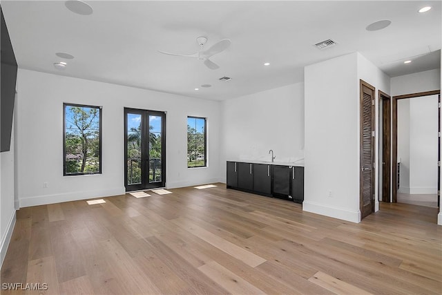 50 Mahogany Dr, Naples, FL 34108 - unfurnished room featuring light wood-style floors, baseboards, recessed lighting, french doors, and a ceiling fan