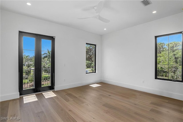 50 Mahogany Dr, Naples, FL 34108 - empty room featuring recessed lighting, visible vents, baseboards, french doors, and wood finished floors