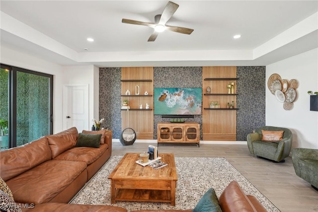 living room with wallpapered walls, a ceiling fan, wood finished floors, and recessed lighting