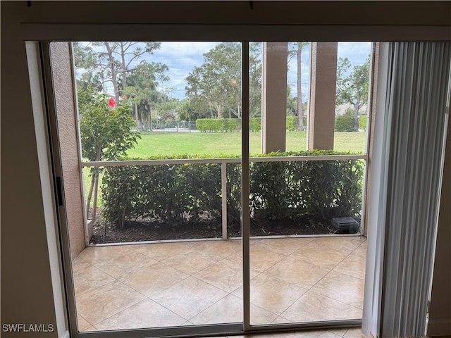 doorway to outside featuring tile patterned floors