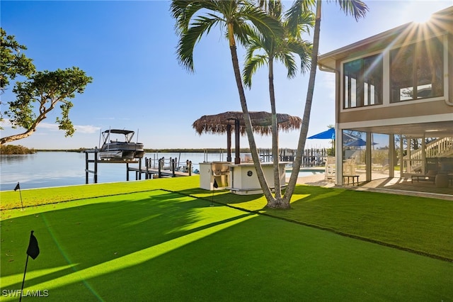 exterior space with a yard and a water view