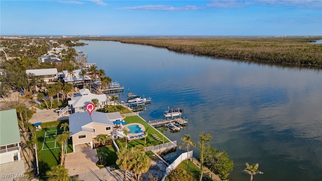 birds eye view of property with a water view