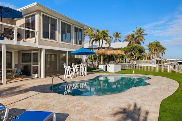 view of pool with a yard and a patio area