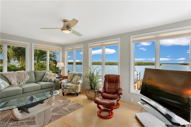 sunroom / solarium featuring ceiling fan