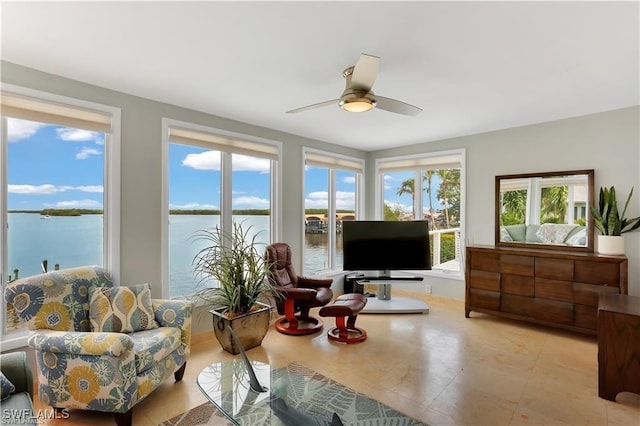 sunroom with ceiling fan and a healthy amount of sunlight