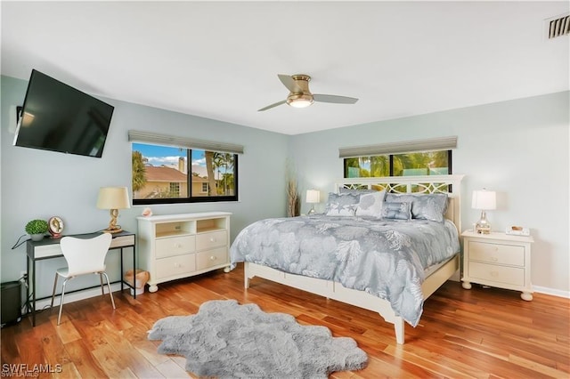 bedroom featuring ceiling fan and hardwood / wood-style floors