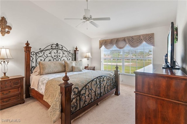 bedroom with ceiling fan, vaulted ceiling, and light carpet