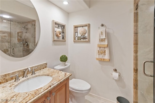 bathroom featuring walk in shower, vanity, and toilet