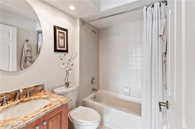 full bathroom with vanity, shower / bathtub combination with curtain, and toilet