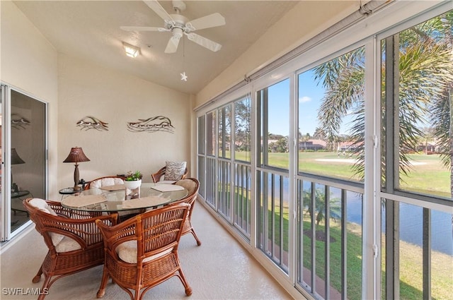 sunroom featuring ceiling fan and vaulted ceiling