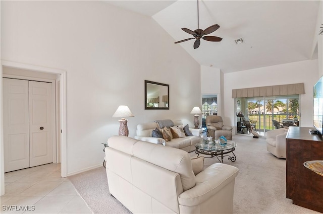 living room with ceiling fan, high vaulted ceiling, and light tile patterned floors