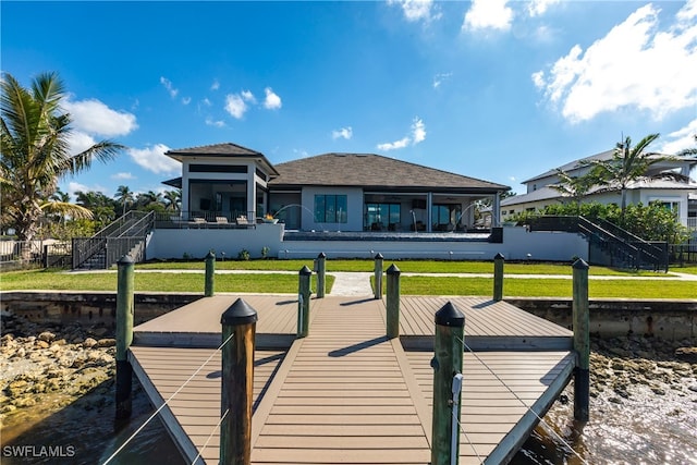 dock area featuring a lawn