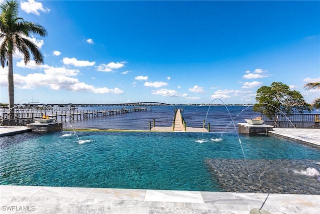 view of swimming pool with a water view