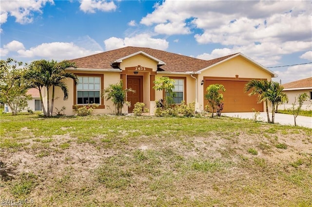 ranch-style house with a garage and a front lawn