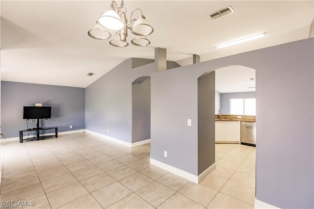 unfurnished living room with lofted ceiling, sink, a notable chandelier, and light tile patterned flooring