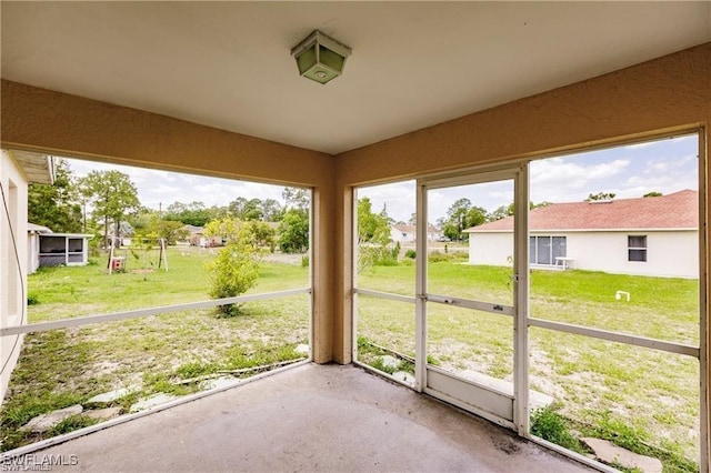 unfurnished sunroom featuring plenty of natural light