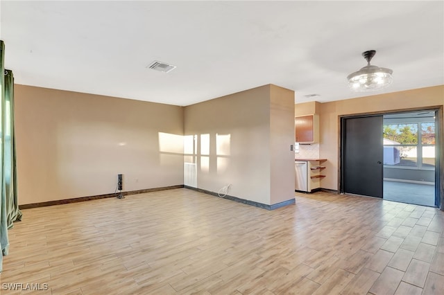 unfurnished room with light hardwood / wood-style flooring