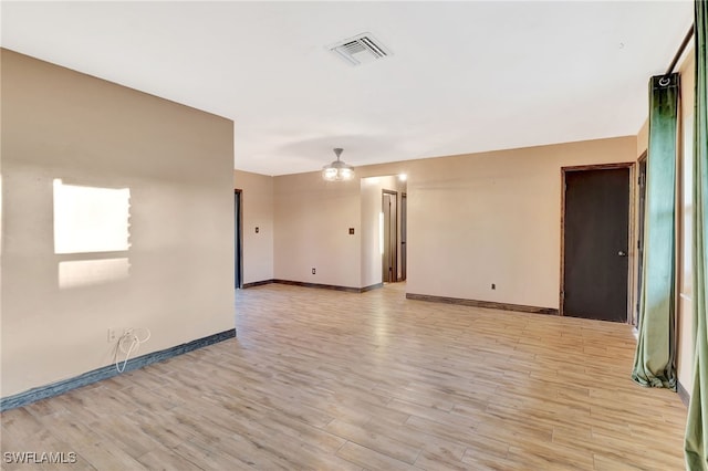 unfurnished room featuring light wood-type flooring