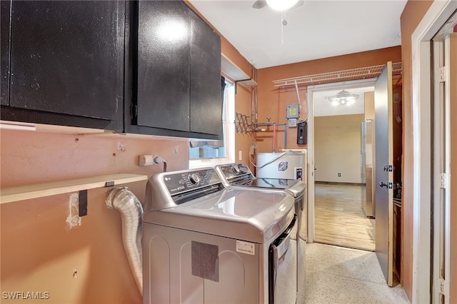 laundry room with cabinets and separate washer and dryer