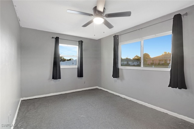 carpeted empty room with ceiling fan