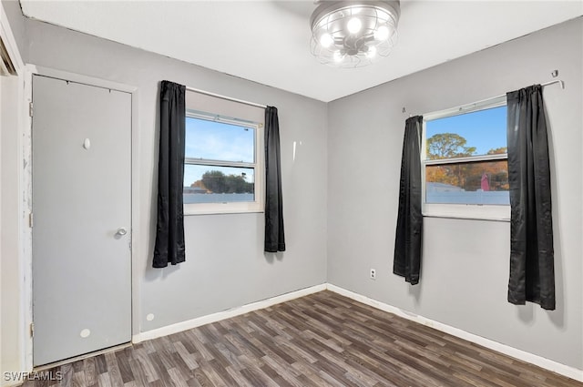 spare room featuring dark hardwood / wood-style floors