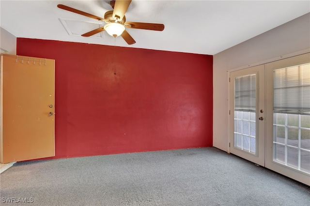 unfurnished room with french doors, ceiling fan, and carpet flooring