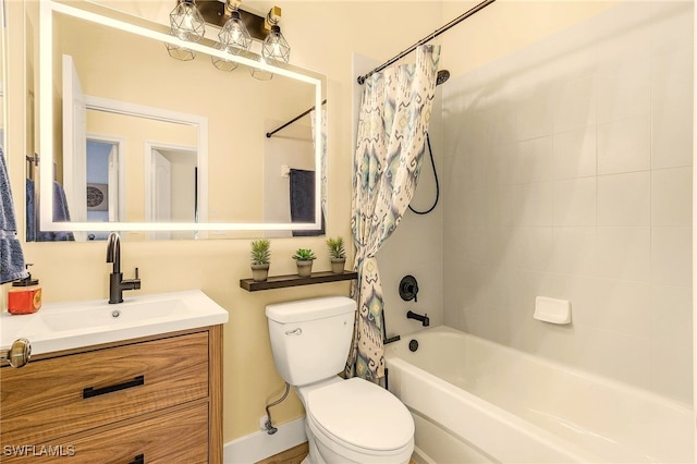 bathroom with shower / tub combo, vanity, and toilet