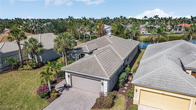 bird's eye view featuring a water view and a residential view