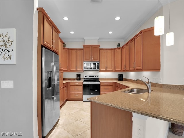 kitchen featuring appliances with stainless steel finishes, a peninsula, light stone countertops, crown molding, and a sink