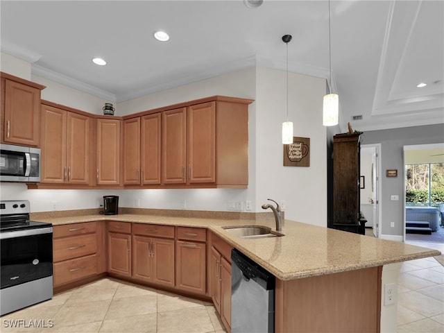 kitchen with crown molding, appliances with stainless steel finishes, a sink, light stone countertops, and a peninsula