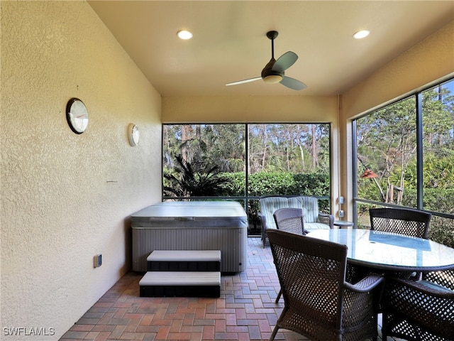 sunroom / solarium with ceiling fan