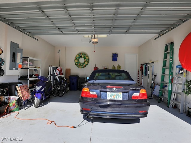 garage featuring electric panel and a garage door opener