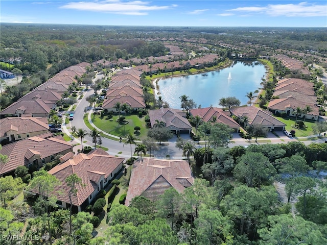 bird's eye view with a water view and a residential view