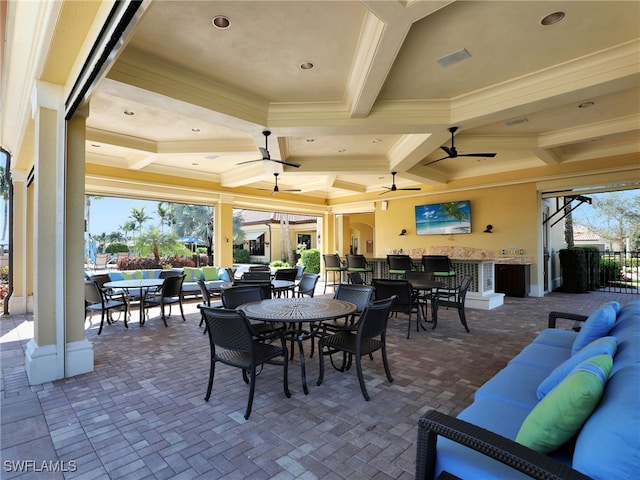 view of patio with an outdoor hangout area, outdoor dining space, and a ceiling fan