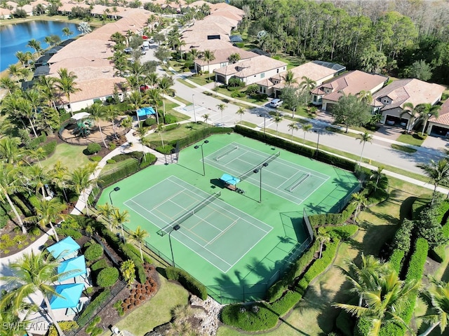 bird's eye view with a residential view and a water view