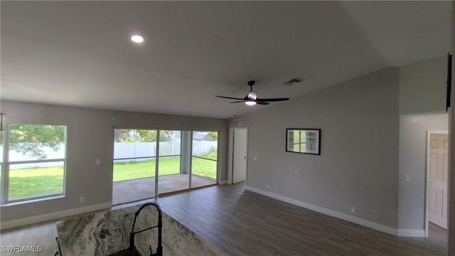 spare room featuring vaulted ceiling, wood-type flooring, and ceiling fan