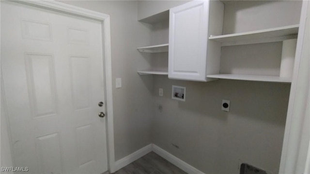 laundry room featuring cabinets, electric dryer hookup, dark wood-type flooring, and washer hookup