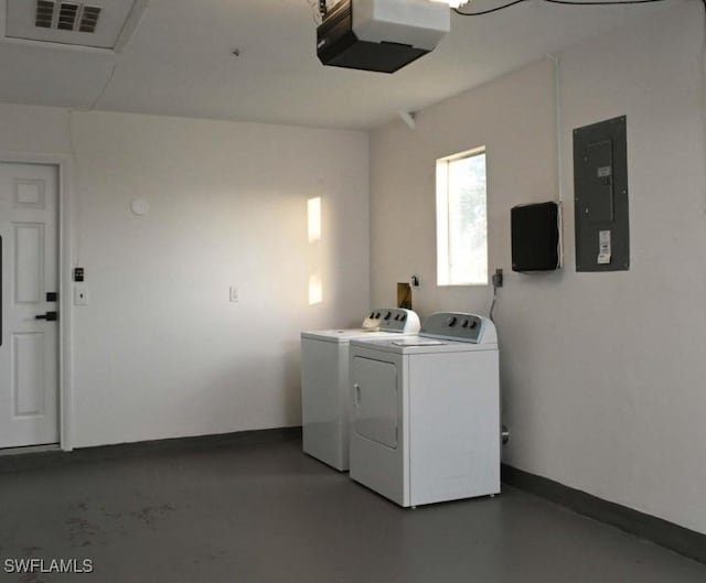 clothes washing area featuring washing machine and clothes dryer and electric panel