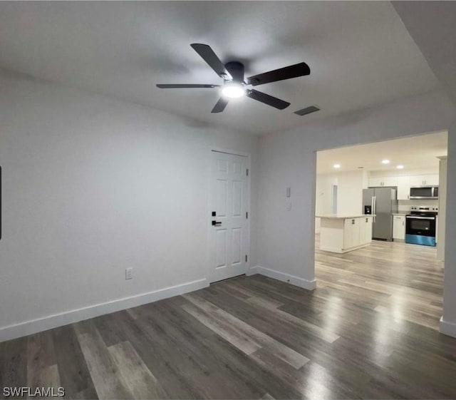 unfurnished living room with ceiling fan and wood-type flooring