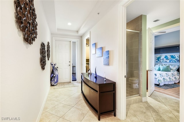 corridor featuring light tile patterned flooring