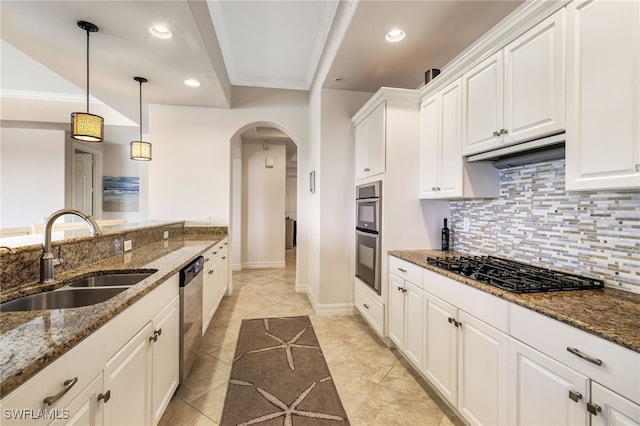 kitchen featuring white cabinets, stainless steel appliances, sink, and dark stone countertops