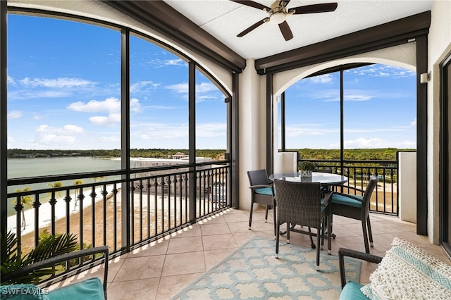10721 Mirasol Dr Unit 601, Miromar Lakes, FL 33913 - sunroom with tile patterned flooring, plenty of natural light, and a water view