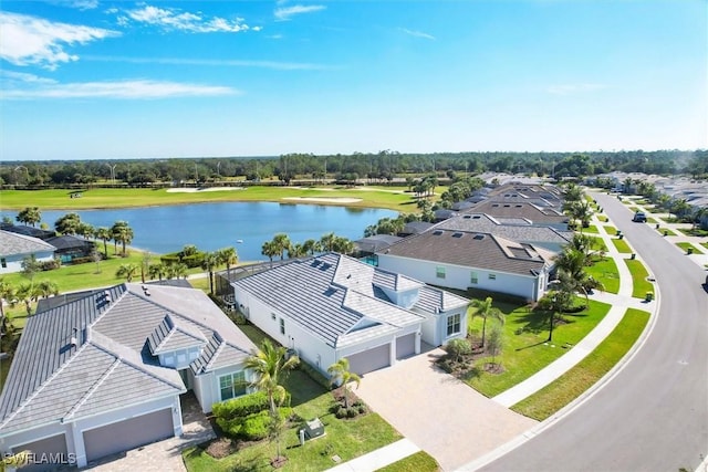 bird's eye view featuring a residential view and a water view