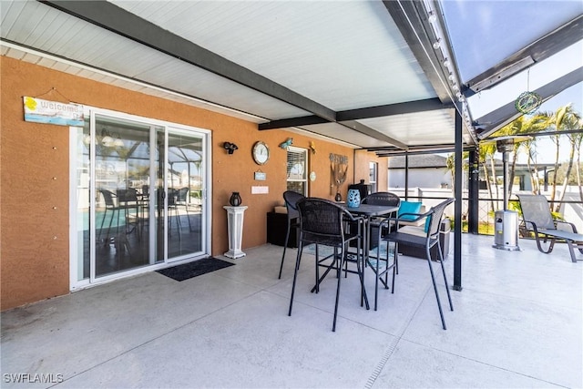 sunroom featuring beamed ceiling