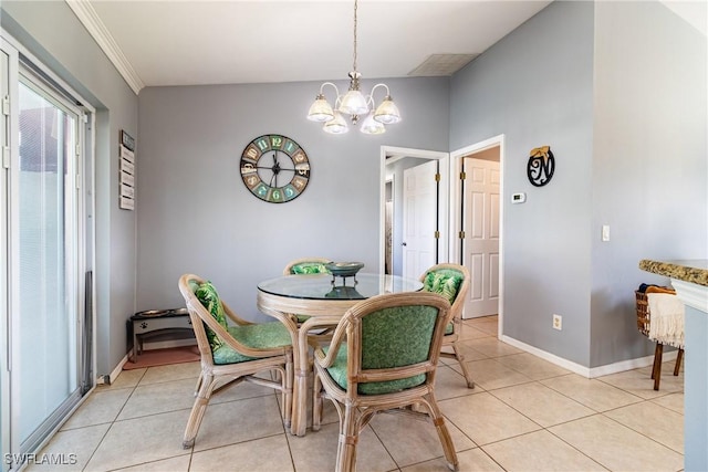 dining area with light tile patterned floors, crown molding, and a chandelier