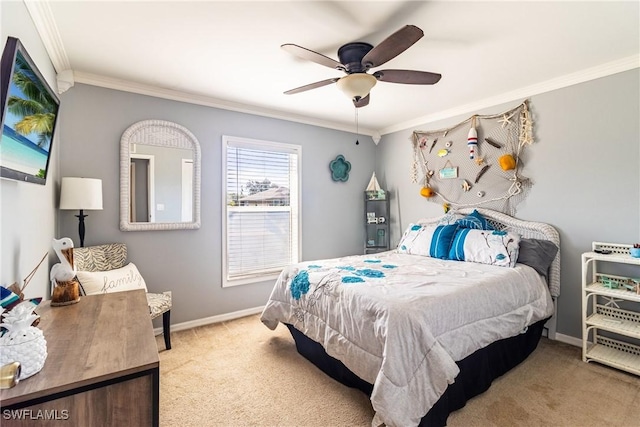 carpeted bedroom with ornamental molding and ceiling fan